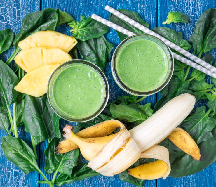 Detox green smoothie with spinach, pineapple, and banana