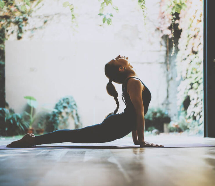 woman doing cobra yoga pose