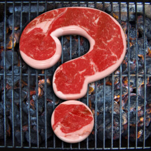 question mark shaped steak on grill conceptual