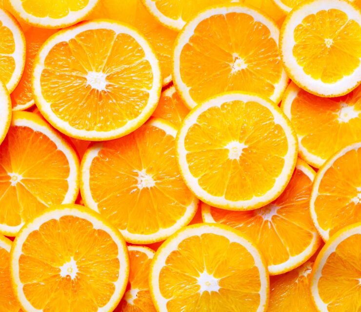 sliced oranges overhead view background
