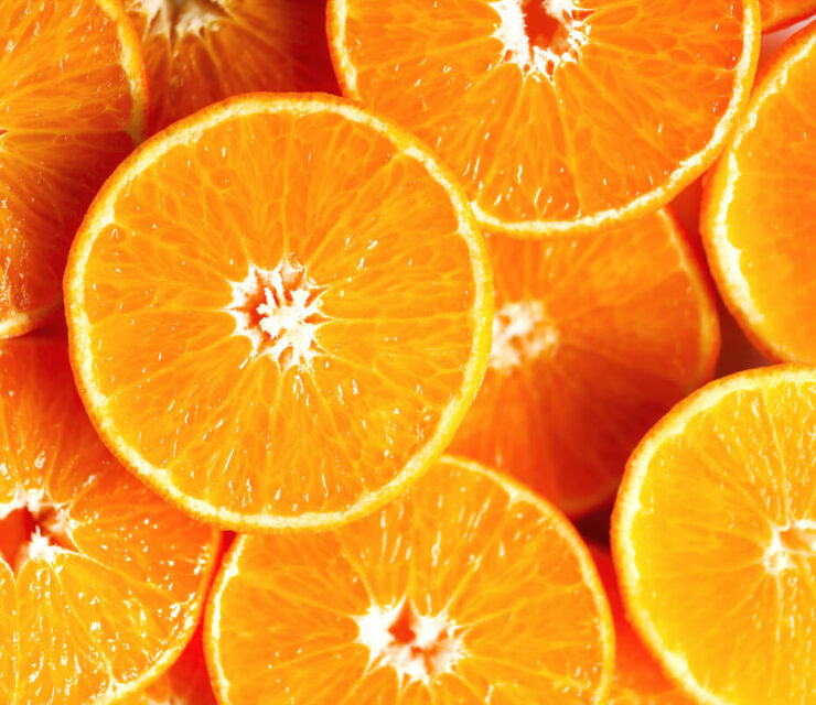 sweet fresh whole and halves of orange fruits