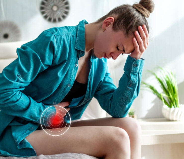 Young upset unhappy woman suffering from menstruation pain, PMS at home. Abdomen and stomach pain during criticals days. Inflammation and infections. Health problems