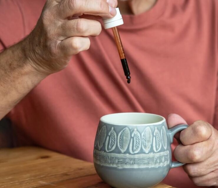 Microdose, Man with a dropper pipette taking the micro dose medicinal cannabis.