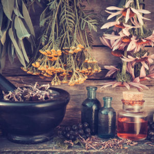 traditional herbal remedies on wood back drop