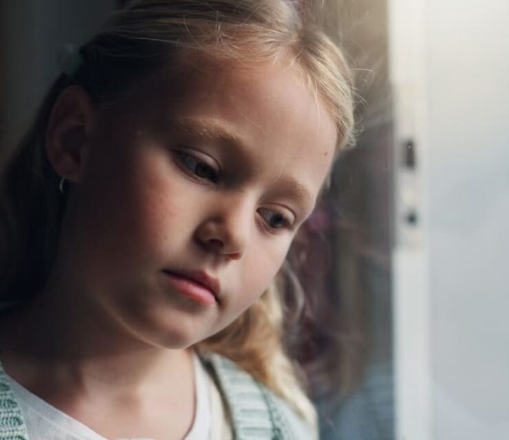 Anxiety, thinking and window with child in home for mental health, adoption crisis or stress. Mistake, foster care trauma and abandon fear with girl at house for sad, reflection and depression