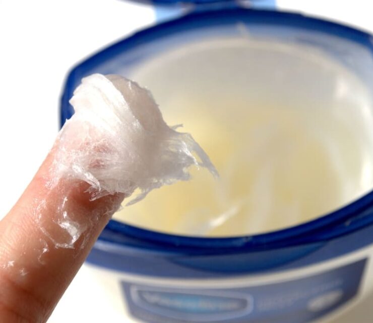 Skin care image. Take hand cream with your fingers.