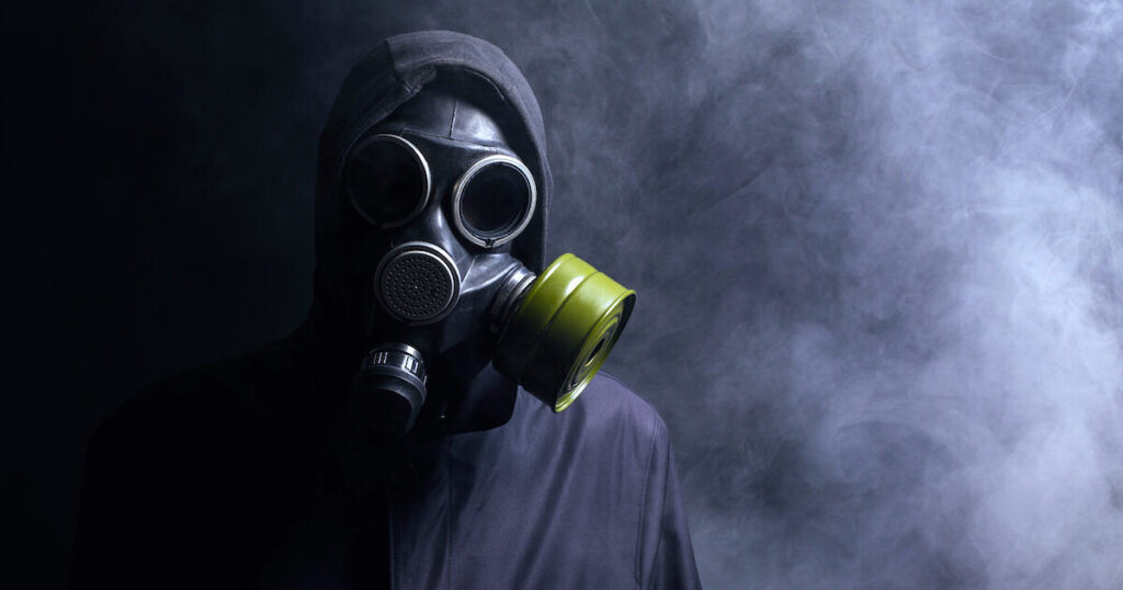 man wearing gasmask in representation of a toxic person