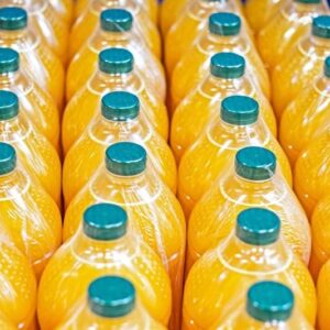 orange juice and other drinks packed in plastic containers with green plastic lids