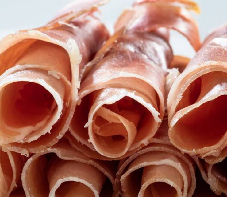 Photo of Cold Cuts Rolled up On Top of Each Other