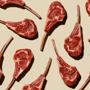 Horizontal Pattern of Raw fresh meat Tomahawk Steak on beige background flatlay food