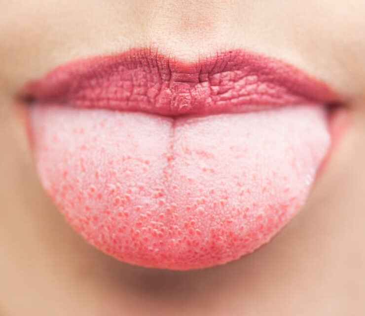 Extreme close up on beautiful cheeky mouth tongue out