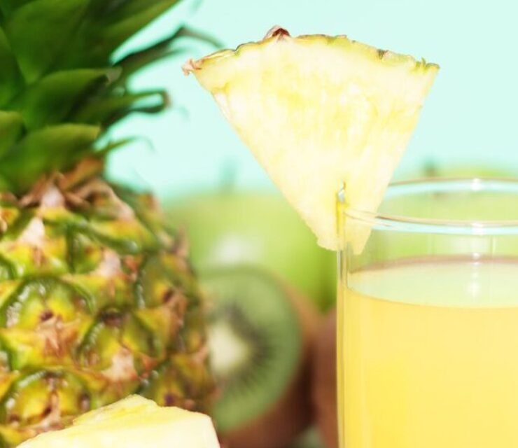 Pineapple Juice and fruit on light background